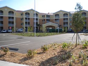 Venice apartment for rent - A parking lot in front of apartment buildings.