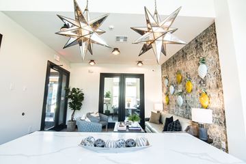 Longview apartment for rent - A living room with a white couch and a star-shaped light fixture.