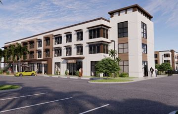 Ft Myers apartment for rent - A modern building with a parking lot in front.