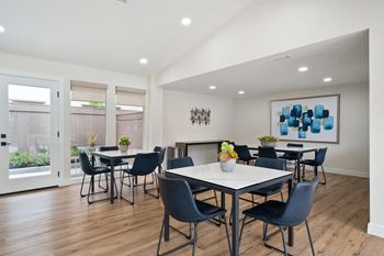 Community clubhouse with tv, living & dining area