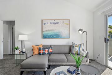 Anaheim apartment for rent - a living room with a couch and a coffee table