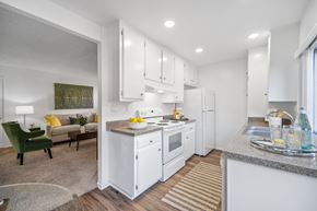 Westminster apartment for rent - a white kitchen with white appliances and white cabinets