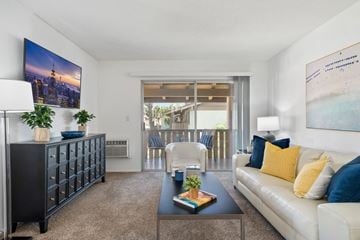 Tustin apartment for rent - a living room with a white couch and a coffee table
