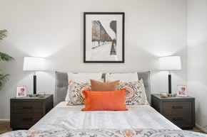 Costa Mesa townhouse for rent - a bedroom with a bed and two night stands with lamps on them