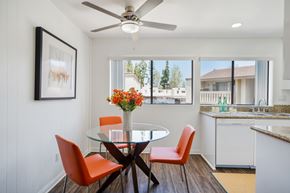 Fullerton apartment for rent - A dining room with a glass table and chairs.