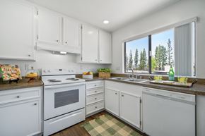 Fullerton apartment for rent - a white kitchen with white appliances and white cabinets