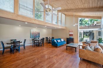 Community clubhouse with tv, living & dining areas