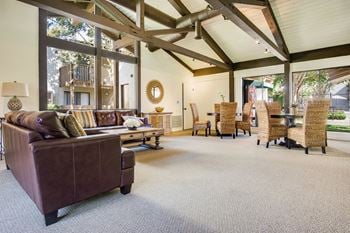 Community clubhouse with tv, living & dining areas