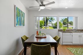 Fullerton apartment for rent - a dining room with a table and chairs and a ceiling fan