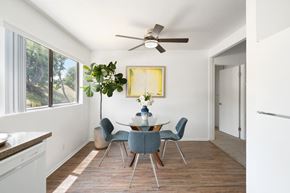 Rowland Heights apartment for rent - a dining room with a table and chairs and a ceiling fan