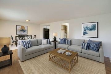 Lakewood apartment for rent - A living room with a grey couch and a coffee table.