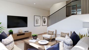 Poulsbo apartment for rent - A living room with a sofa set, a coffee table, and a TV on the wall.
