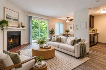 Burien apartment for rent - A living room with a fireplace and a couch.