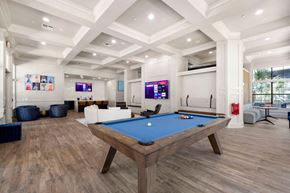 Gainesville apartment for rent - a games room with a pool table in the middle