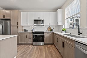 Orlando apartment for rent - A kitchen with wooden cabinets and stainless steel appliances.