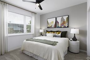 West Melbourne apartment for rent - a bedroom with a large bed and a window