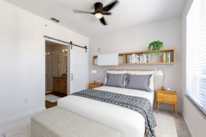 Eagle apartment for rent - a bedroom with a bed and a ceiling fan