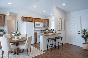 Coeur D Alene apartment for rent - A kitchen with a table and chairs in the middle of the room.