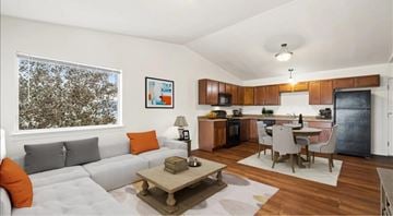 Billings apartment for rent - A modern living room with a grey sofa and a wooden coffee table.