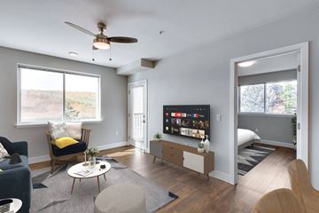 Moscow apartment for rent - A living room with a television and a chair.