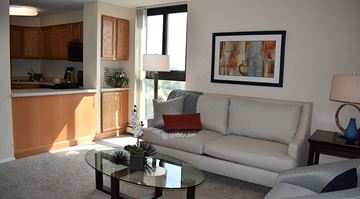 Shorewood apartment for rent - A living room with a couch, coffee table, and a painting on the wall.