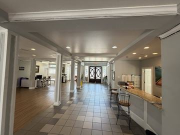 Houston apartment for rent - A long hallway with a kitchen area on the right.