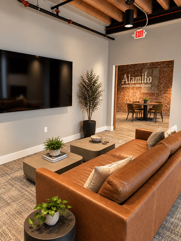 Omaha apartment for rent - A living room with a brown couch and a flat screen TV mounted on the wall.