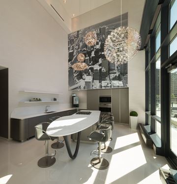 Chicago apartment for rent - A modern kitchen with a large table and chairs.