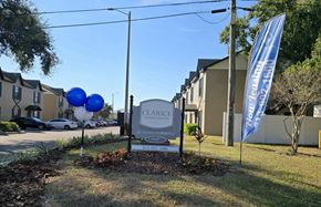 Tampa apartment for rent - A Clarice Apartments sign is in front of a building.
