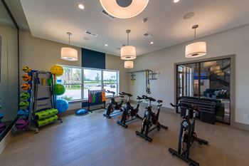 Fitness studio with exercise bikes and equipment