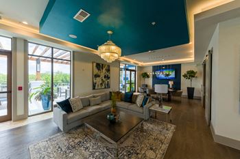 Resident lounge with sectional seating and entertainment area