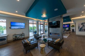 Contemporary lounge with fireplace and geometric ceiling feature