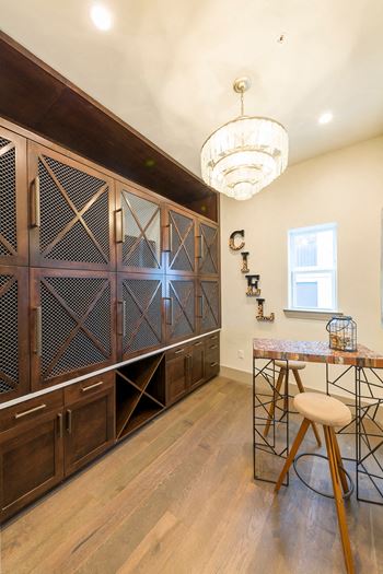 Butler pantry with wine storage and bar seating