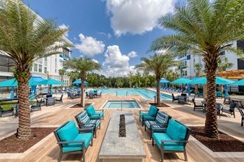 Pool area with fire pit and outdoor seating