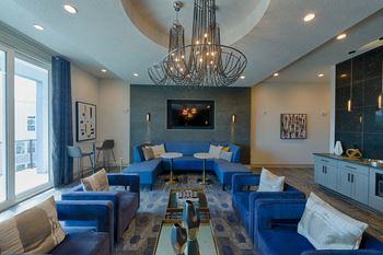 Resident clubhouse with blue sectional seating