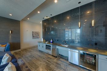 Modern kitchen with sparkling blue backsplash