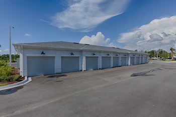 Covered garage building with multiple bay doors