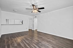 Tampa apartment for rent - a bedroom with hardwood floors and a ceiling fan