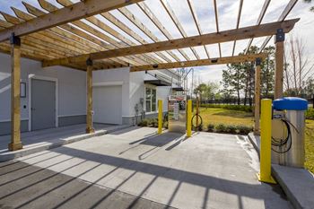 Car wash station with wooden pergola overhead