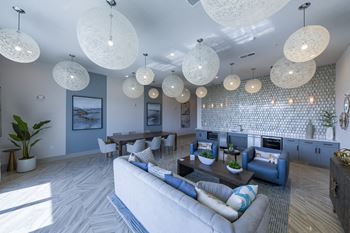 Community clubhouse with woven pendant lighting and kitchen