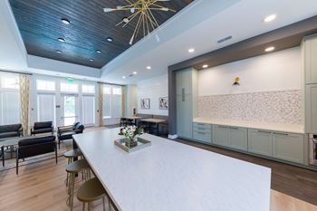 Nathan ridge apartments - clubroom with kitchen and tvs