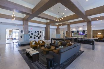 Community clubhouse with lounge seating and pool table