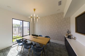 Modern dining room with geometric accent wall