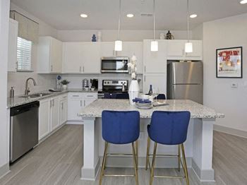 Modern kitchen island with blue bar stools