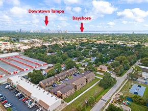 Tampa apartment for rent - an aerial view of the city of bayshore with the downtown tampa skyline in