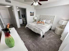 Palm Bay apartment for rent - a bedroom with a bed and a vase on the floor