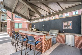 Outdoor summer kitchen with gas grills