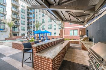 Outdoor summer kitchen with gas grills