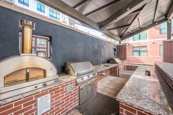Outdoor summer kitchen with gas grills