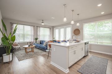 Jacksonville apartment for rent - A well-lit, spacious kitchen and living room with a dining table and chairs.